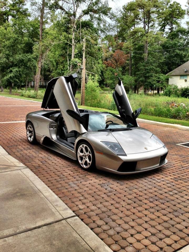 A silver Lamborghini Murcielago presented outdoors