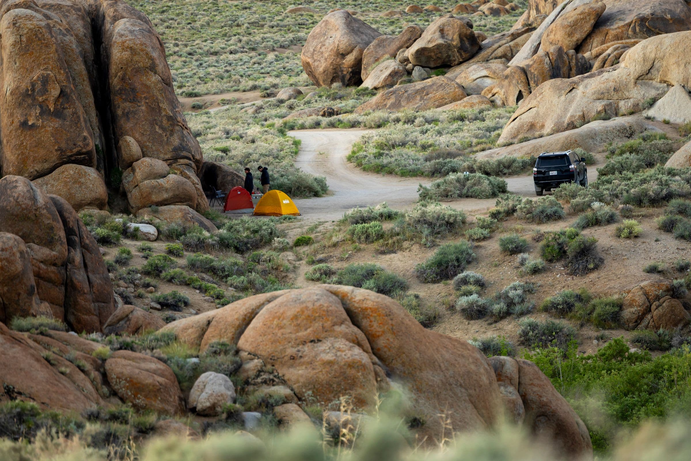 A remote camp built around an independent automotive expedition