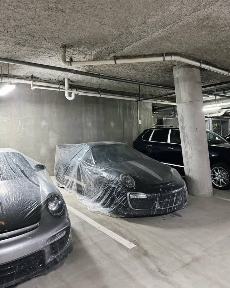 Two protected collector cars in storage