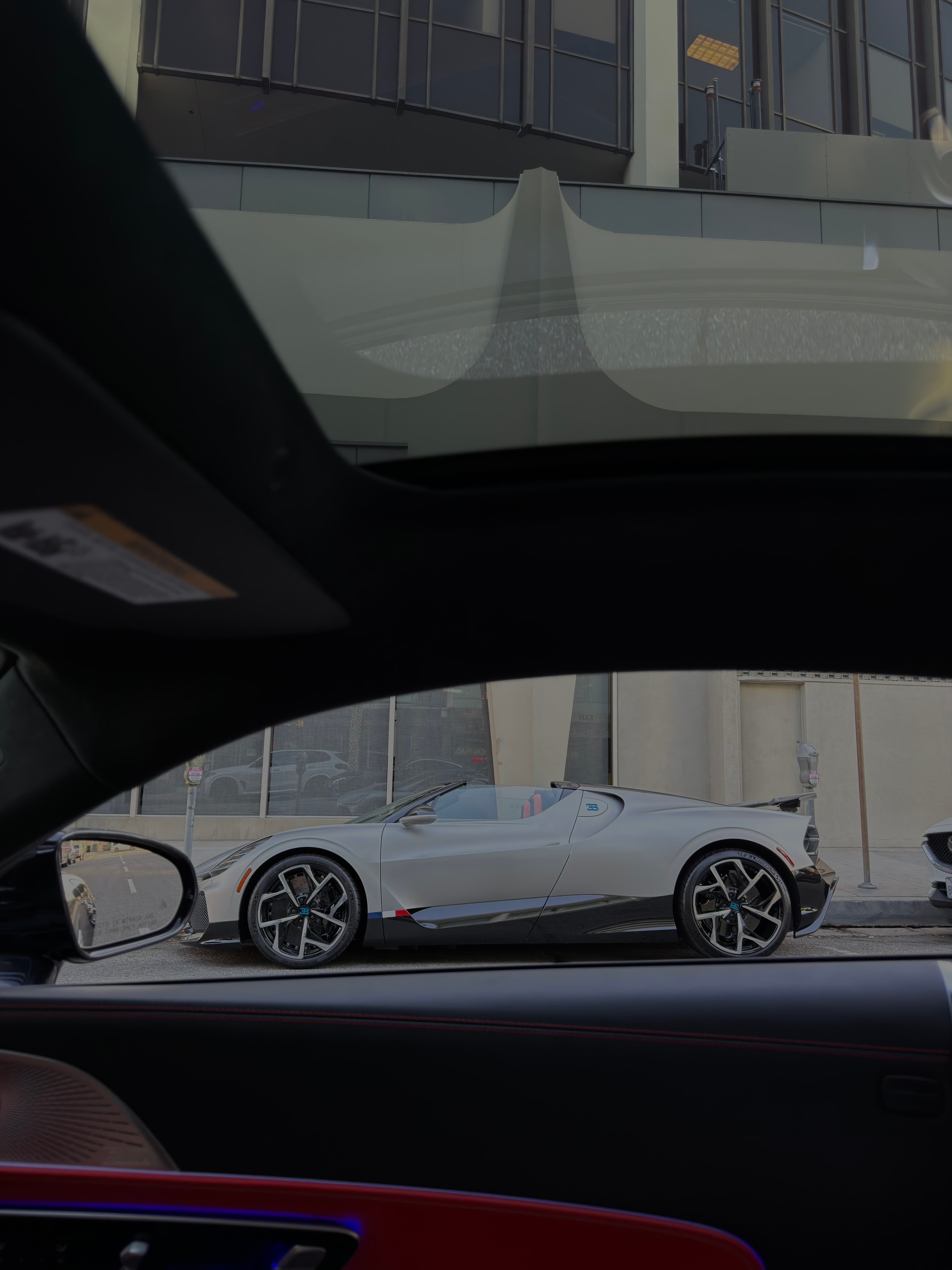 A collector car seen through the interior of another car