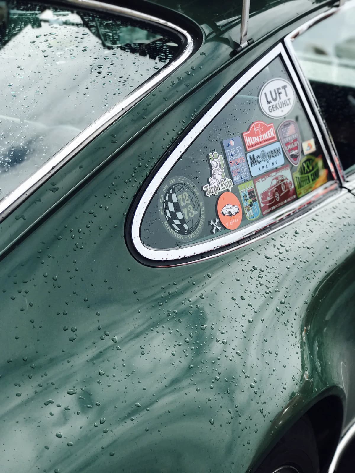 Rain across the side window of a vintage Porsche