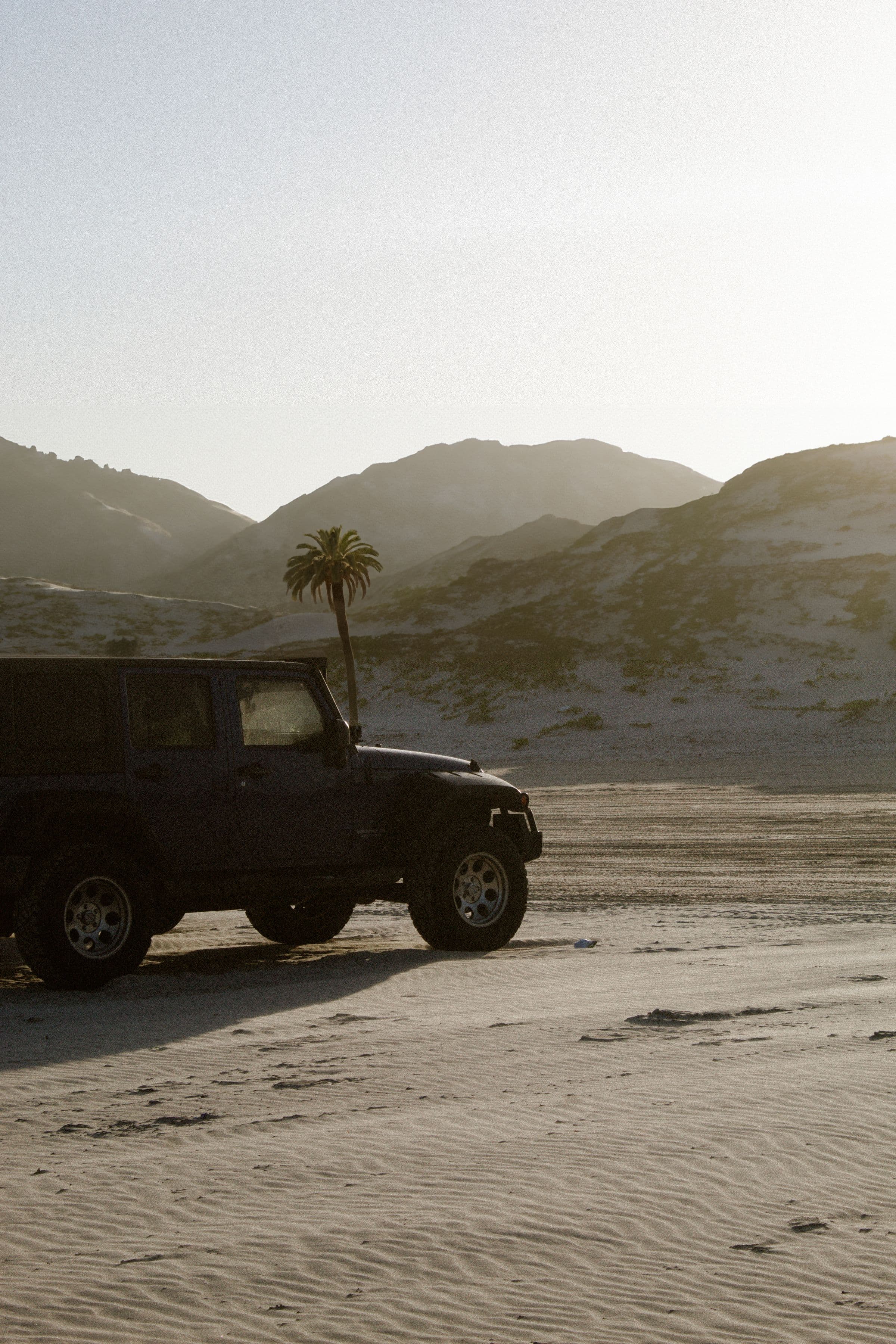 A 4x4 moving through an open Namibian landscape